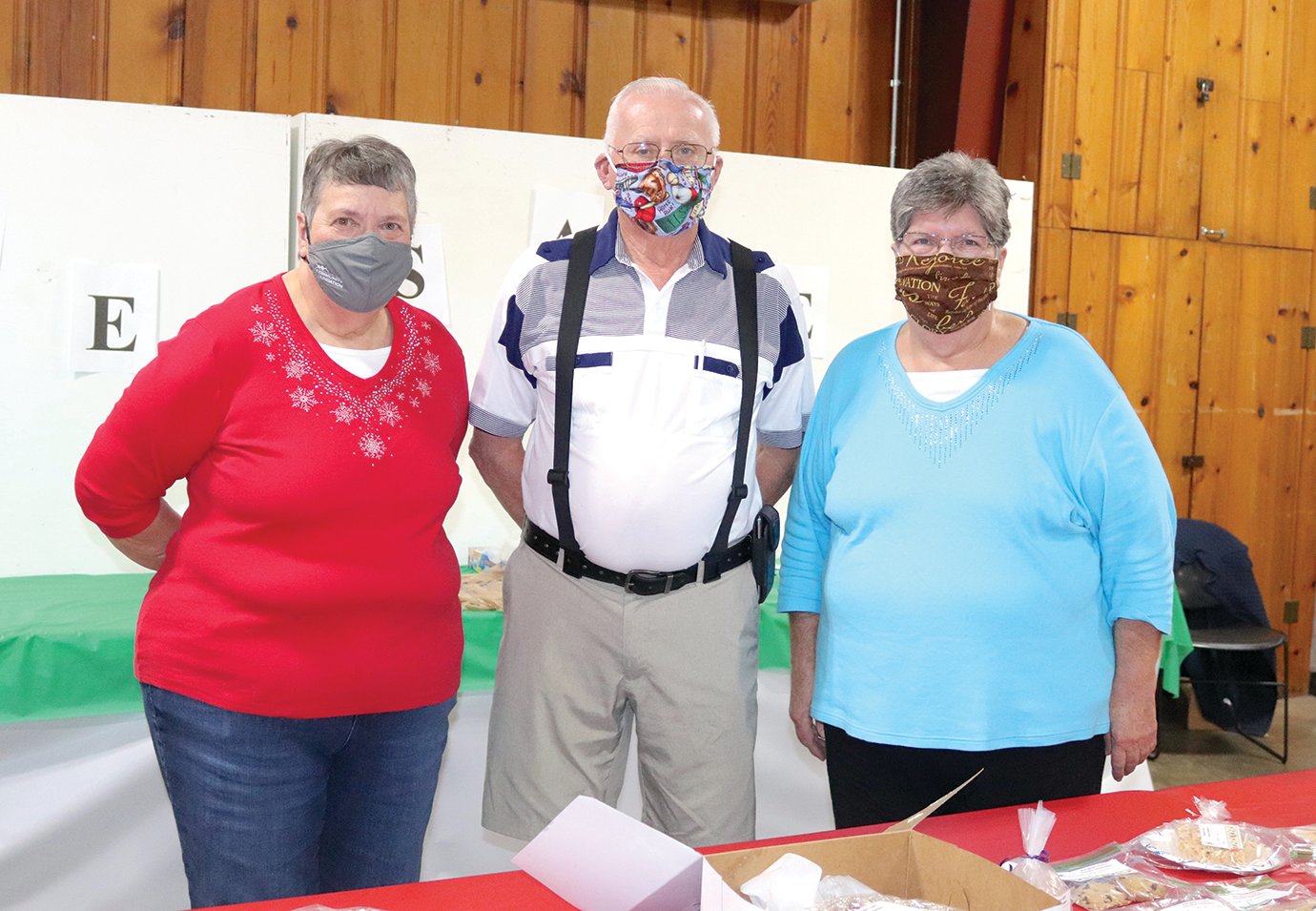 Gloria Oliver, from left, Marvin Swick and Martha Swick volunteer their time at the annual Extension Homemakers Club Holiday Expo at the Fairgrounds Saturday. The trio manned their posts from 9 a.m.-3 p.m., serving baked goods to hundreds of visitors throughout the day.